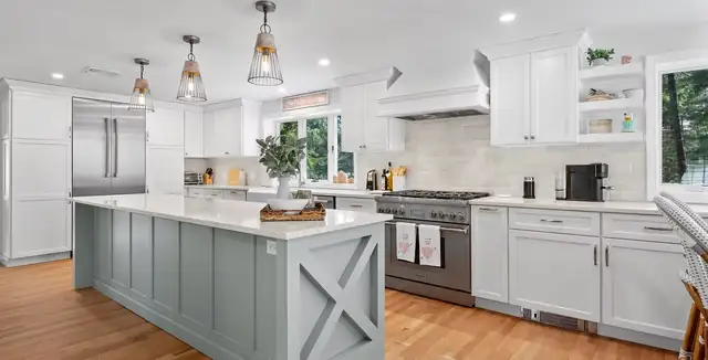 Lynnfield kitchen with white cabinets, a soft blue island with X-panel ends and a stainless range